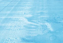 BACHE A BULLES PISCINE BOIS MONTANA BORDEE 4 COTES